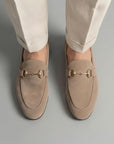 Beige suede loafers with horsebit detail close-up, almond toe slip-on
