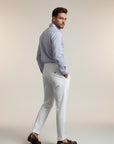 Men's high-waisted straight-leg tailored trousers in white, side view