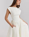 White cap-sleeve midi dress with scooped neckline, defined waist, and gathered skirt