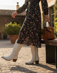 White suede cowboy boots with western embroidery and mid-height block heel