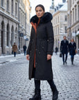 Black waterproof hooded parka with faux fur trim, button front, side pockets