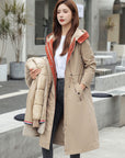 Beige waterproof hooded jacket with faux fur trim, drawstring waist, button front