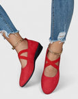 Red wedge ballet flats with ankle strap and cross straps, closed toe.