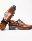 Brown leather buckle dress shoe, side view with visible sole and heel