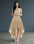 Gold sleeveless high-low cocktail dress with lace bodice and layered chiffon hem