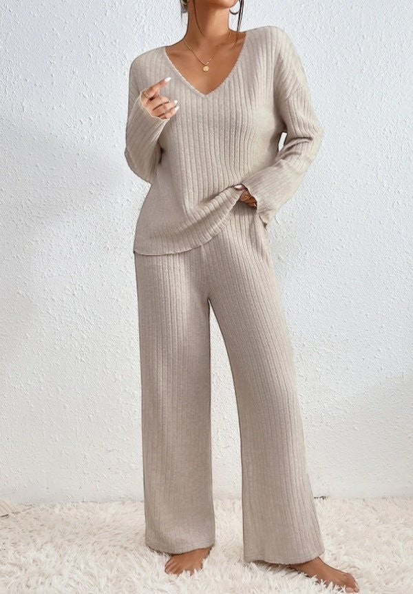 BENJAMIN LONDON beige ribbed knit V-neck loungewear set with wide leg pants.