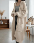 Women's long knitted cardigan, beige, open-front with patch pockets and ribbed cuffs