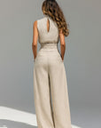 Beige back cutout sleeveless tank top with wide-leg trousers, smocked waistband