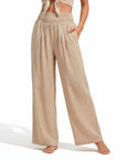 Beige smocked high-waist wide-leg pants with gathered elastic waistband