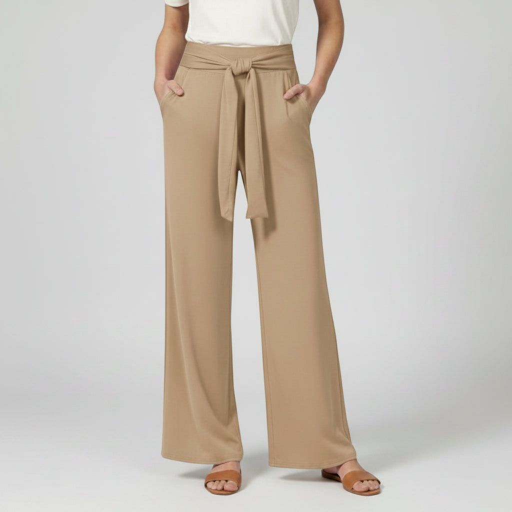 Beige relaxed wide-leg trousers with tie waist and draped front.