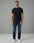 Men's black crew-neck T-shirt with short sleeves, worn with jeans.