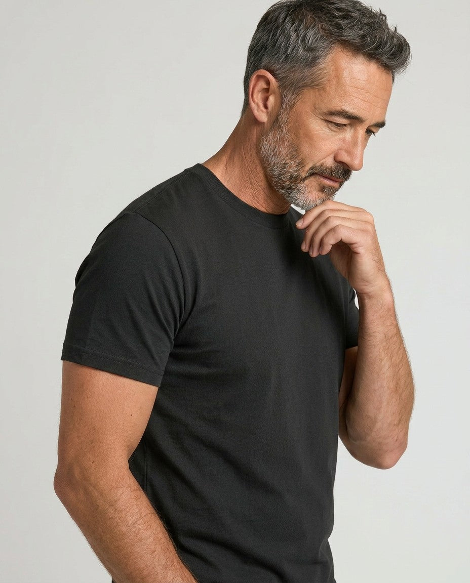 Men's black crew-neck T-shirt detail, short sleeve and neckline from side.