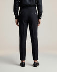 High-waisted tailored trousers in black, double-button waistband and tapered legs