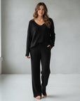 Ribbed knit loungewear set with V-neck top and wide-leg trousers, black