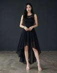 Black sleeveless high-low cocktail dress with lace bodice and chiffon layered skirt