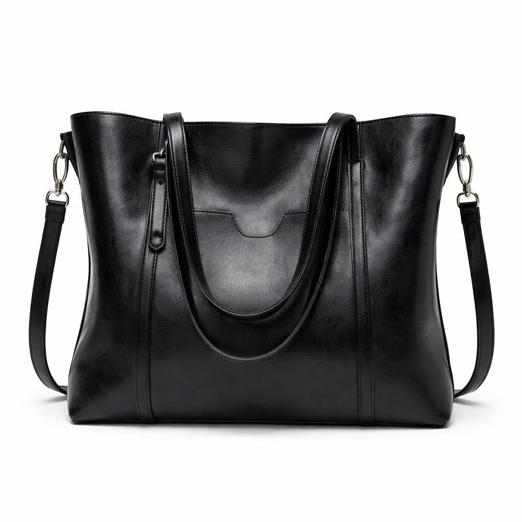 Black leather tote bag with curved top handle, front pocket, and shoulder strap