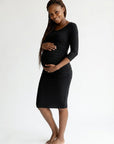Black maternity midi dress with 3/4 sleeves and round neck, fitted stretch fabric.