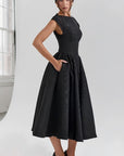 Black cap-sleeve midi dress with fitted waist and full gathered skirt