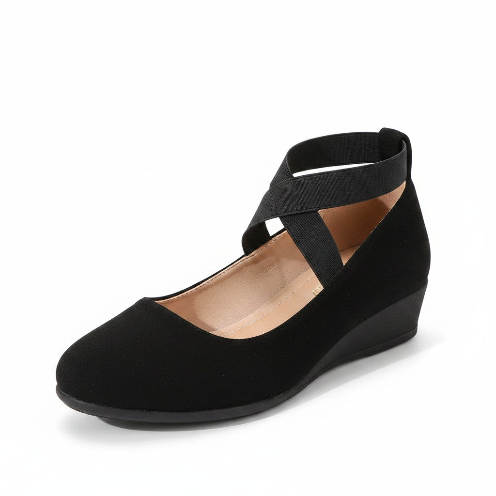 Black wedge ballet flats with T-bar straps and open arch, smooth suede-like finish.