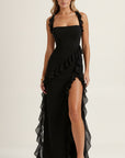 Black maxi dress with ruffled ruffle panels and side slit, spaghetti straps