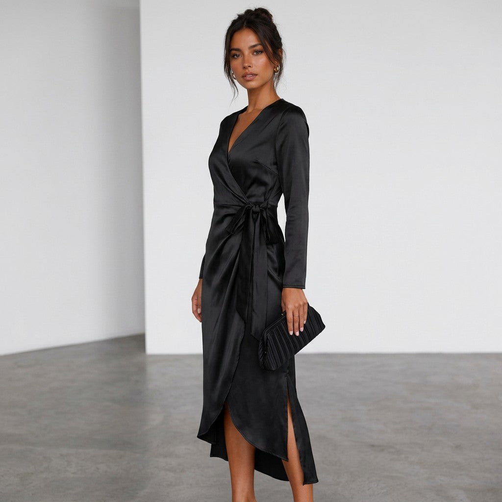Black satin midi wrap dress side view with V-neck, long sleeves, tied waist, slit.