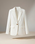 White button blazer with notch lapels and flap pockets