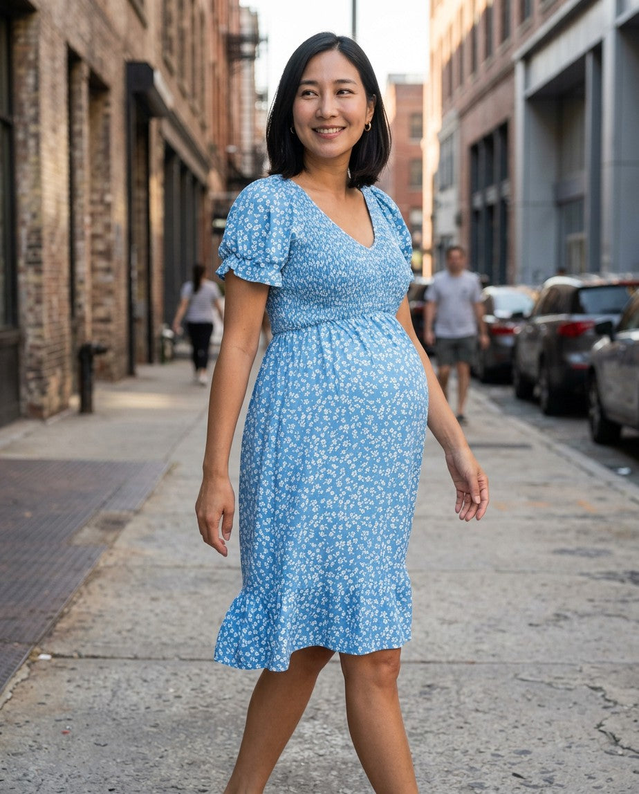 Blue floral maternity dress with V-neck and flutter sleeves, side view