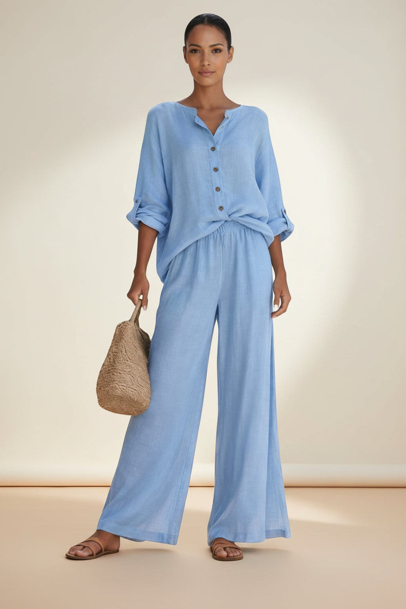 BENJAMIN LONDON light blue linen blend button front blouse and wide leg trousers set on a woman.