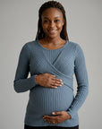 Blue ribbed maternity midi dress with long sleeves and wrap-front crossover bodice