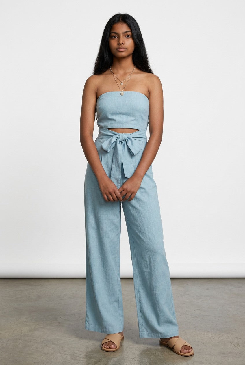Light blue strapless wide-leg jumpsuit with ruched top and bow tie