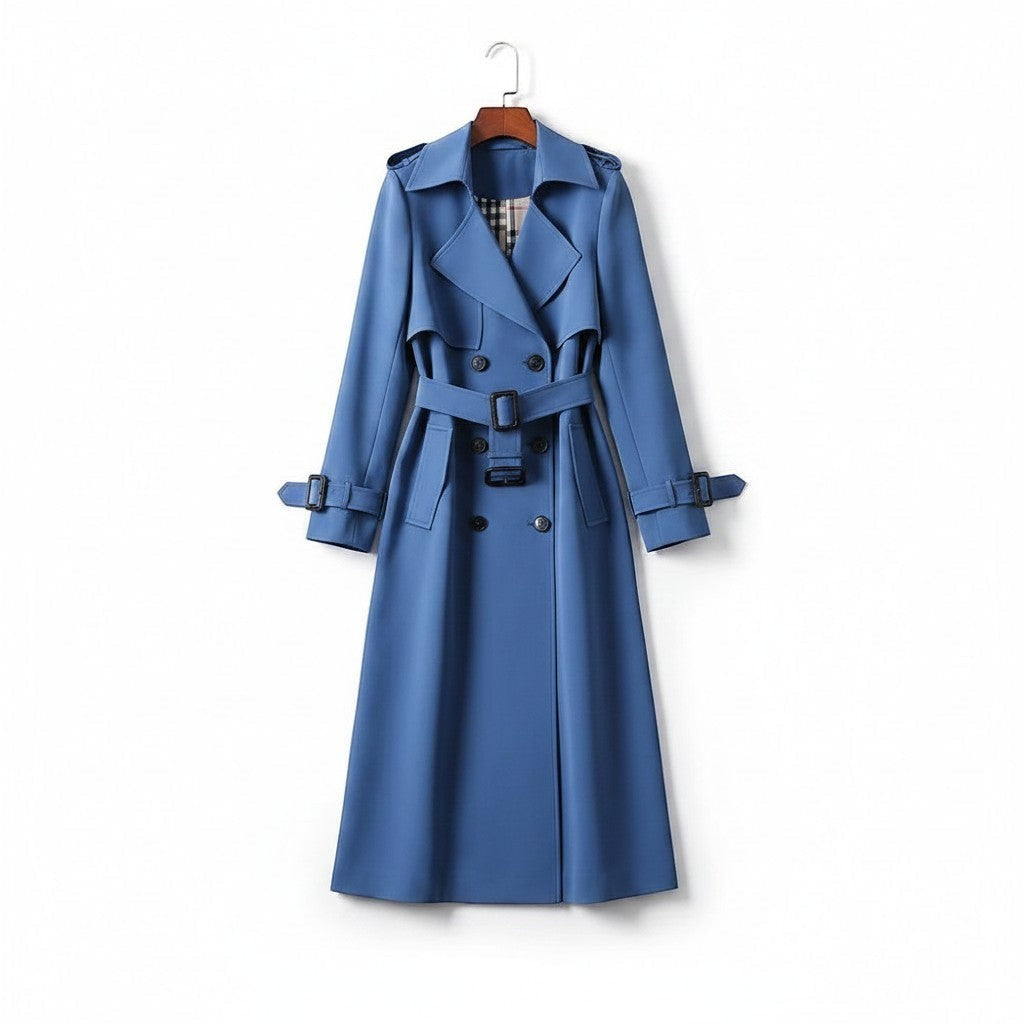 Blue trench coat with double-breasted styling, belted waist, and long sleeves.