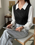 Black V-neck knit blouse with white pointed collar and long sleeves