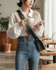 Beige V-neck knit blouse with white pointed collar and long sleeves