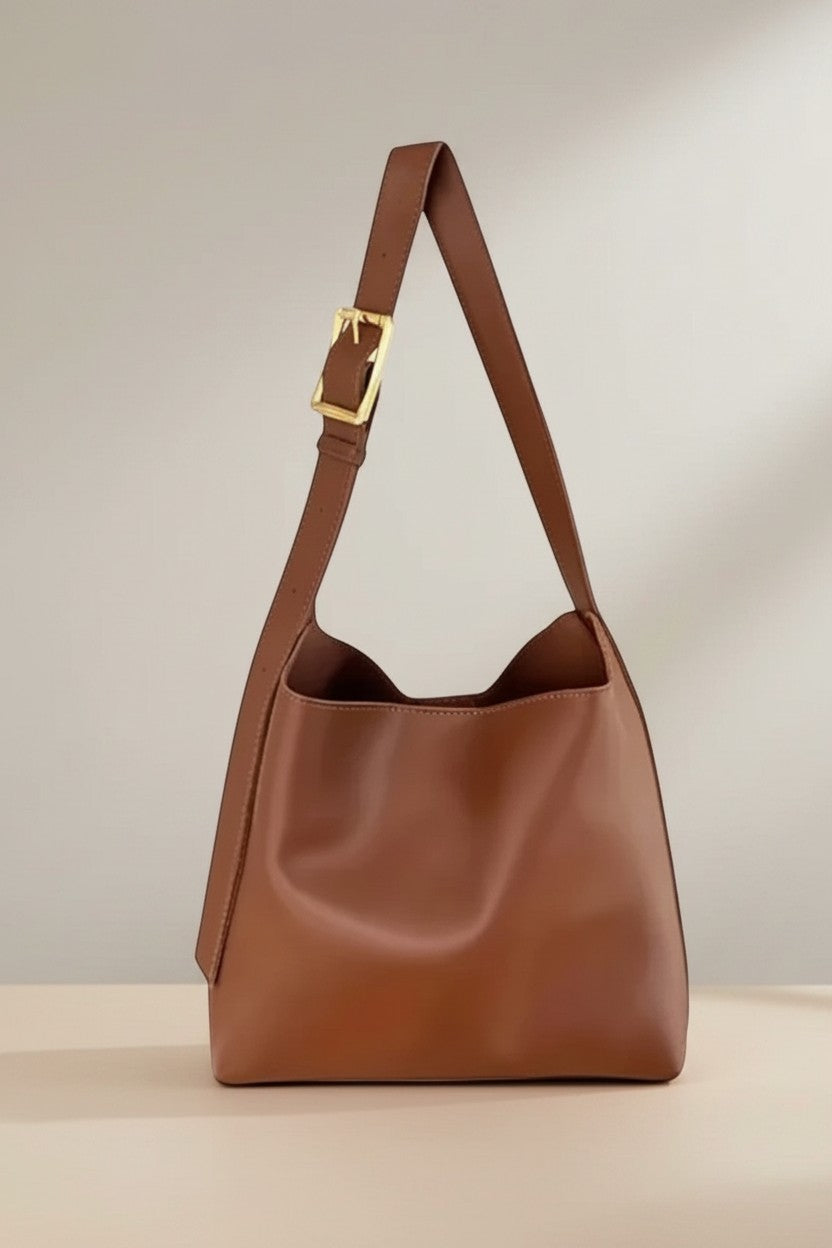 Brown slouchy shoulder bag with gold buckle strap
