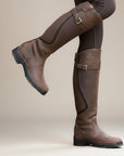 Coffee-brown leather knee-high boots with double buckles and low stacked heel