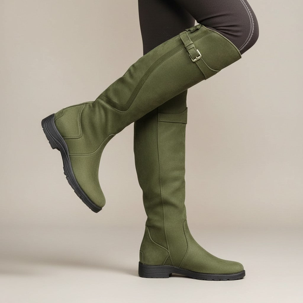 Green leather knee-high boots with side buckle straps and low stacked heel