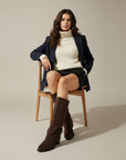 Brown knee-high chunky heel boots on model, front view, suede-look shaft