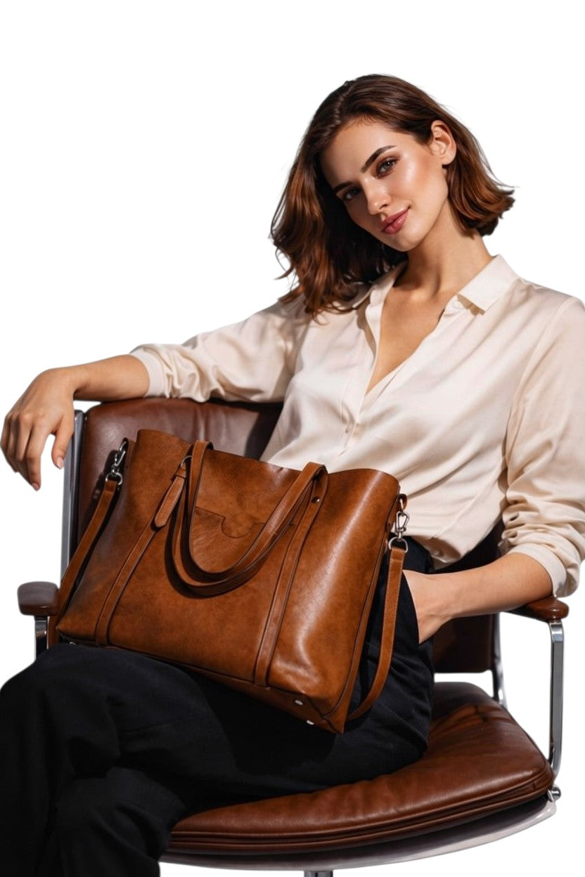 Cognac leather tote bag with long handles and front pocket detail