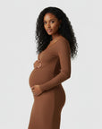Women's brown ribbed knit maternity midi dress, long sleeves, V-neck placket, close-up.