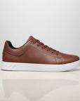 Brown low-top trainers with lace-up front and white rubber sole