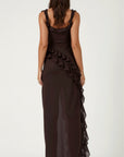 Dark brown maxi dress with ruffled shoulder straps and layered back design