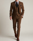 Brown tweed three-piece suit, vest and trousers with single-breasted blazer, pocket square