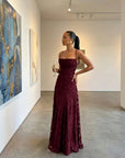 Open-back burgundy jacquard maxi dress with floral texture and spaghetti straps