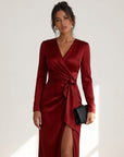 Red satin midi wrap dress with V-neck, long sleeves, tied waist and side slit.