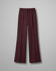 High-waist tailored trousers in burgundy with belt loops and front button closure
