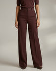High-waist tailored trousers in deep plum with belt loops and front button closure