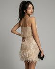 Beige/gold sequin mini dress with spaghetti straps and feather fringe hem