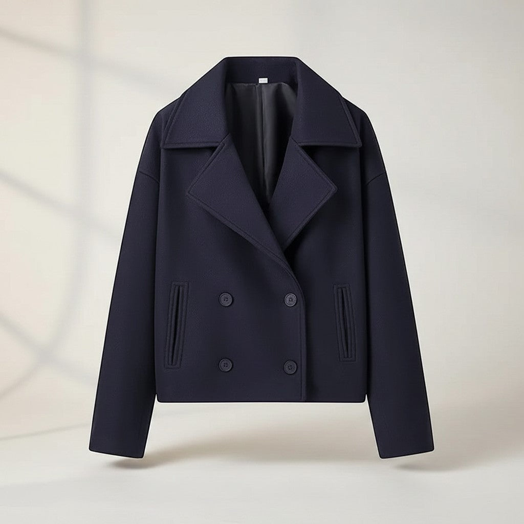 Navy double-breasted jacket with structured lapels, four-button front, and flap pockets