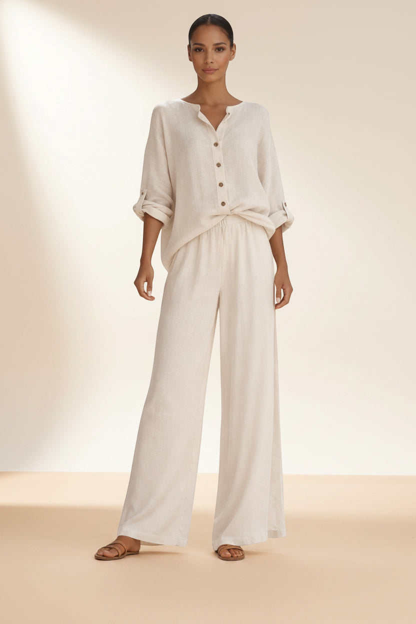 BENJAMIN LONDON cream linen blend button front blouse and wide leg trousers set on a woman.