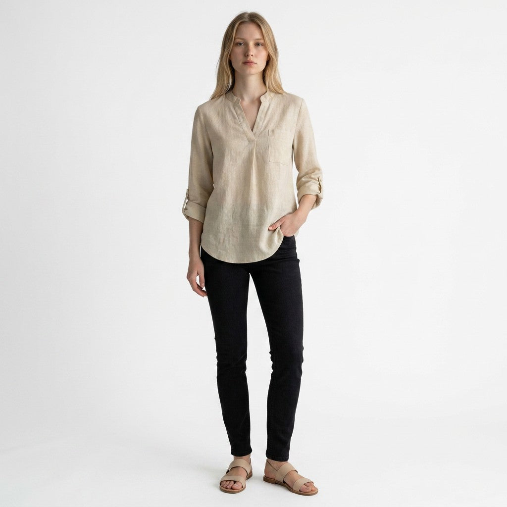 Beige linen blouse with V-neck and partial button placket, three-quarter rolled sleeves.